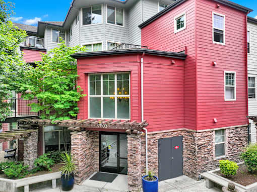 A red building with a black door and windows.