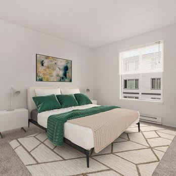 A bedroom with a large bed and a painting on the wall.
