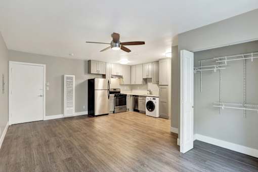 A kitchen with a refrigerator, dishwasher, and washing machine.at Federal Apartments, Los Angeles, CA 90025