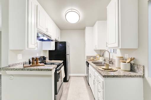 Kitchen with White Cabinetry at La Fayette Marquis, Los Angeles, CA, 90057