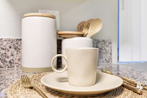 White Mug with Handle, spoon and fork at La Fayette Marquis, Los Angeles