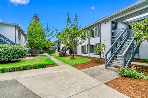 A sunny day at a residential complex with a clear blue sky.