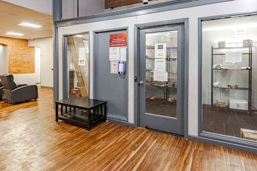 A room with a glass door and a sign on it.