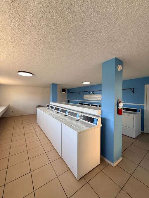 A laundry room with a washer and dryer.