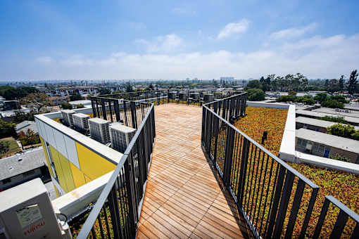 a roof top deck with a view of the city