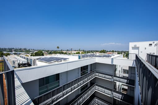 a view of the city from the balcony of a building