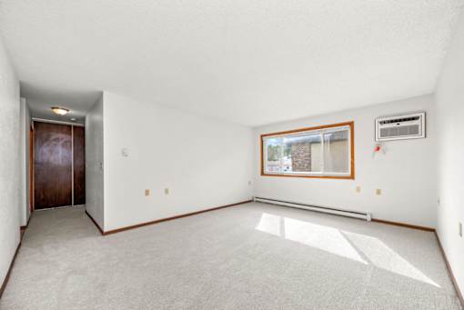 A room with a window and a door.