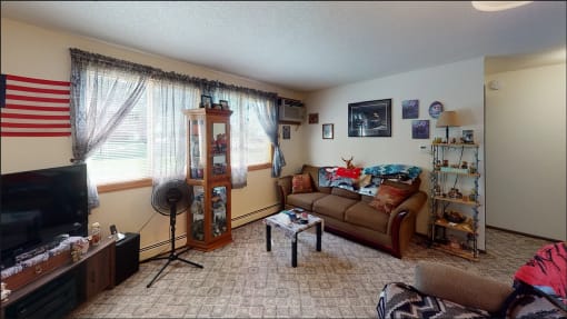 a living room with a couch and a tv