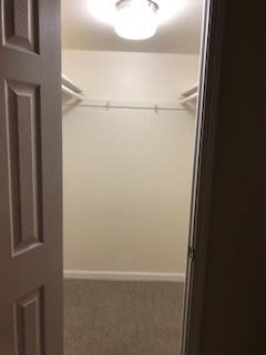 a room with a white wall and a door