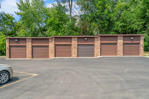 a row of garage doors in a parking lot