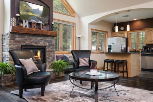 a living room with a fireplace and a table