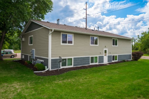 the front of the house has been updated with new siding and new windows