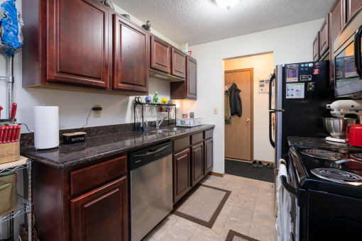 a kitchen with a counter top and a refrigerator