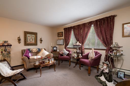a living room filled with furniture and a window