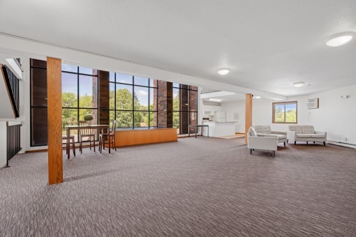 a large living room with a dining room and a kitchen