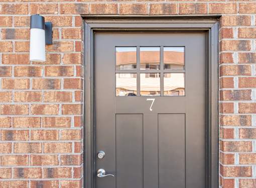 A grey door with the number 7 on it.