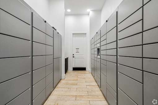 A long hallway with a door at the end.