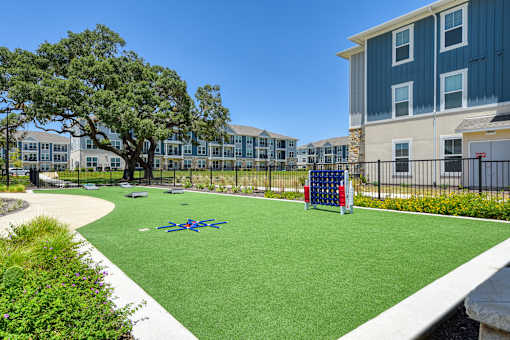 an image of a playground in front of an apartment building at Estraya Boerne, Texas, 78006