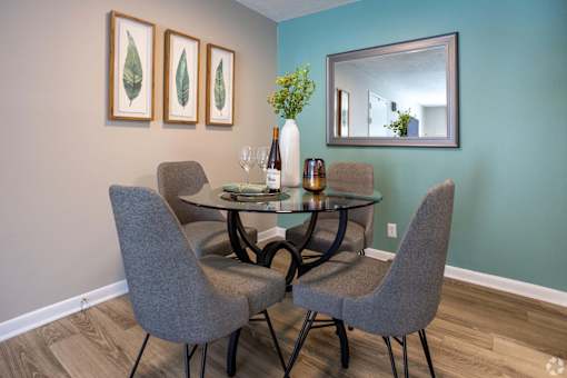 A dining room with a table and chairs.at Addison at Sutherland, Knoxville Tennessee  