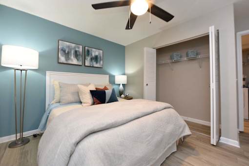 A bedroom with a large bed and a ceiling fan.at Addison at Sutherland, Tennessee, 37909