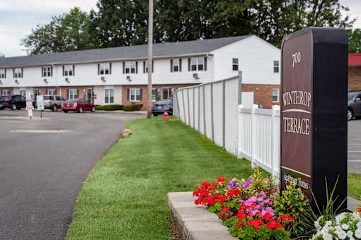 A sign that says Terrace in front of a building.
