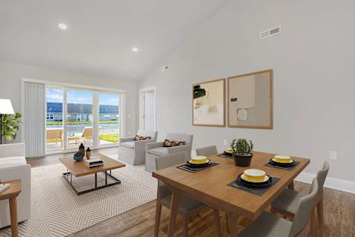 A modern dining room with a wooden table set for four.