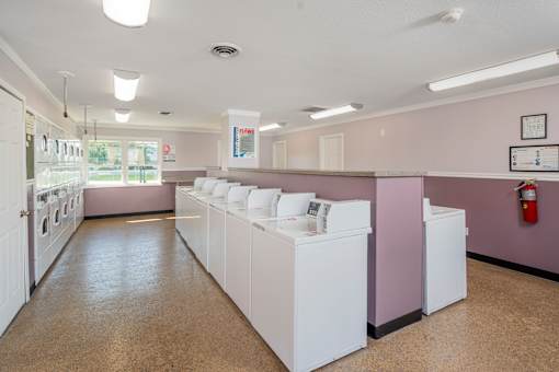 A laundromat with washers and dryers.