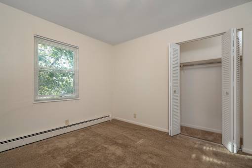 A room with a window and a door.