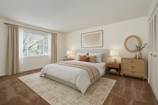 A bedroom with a large bed, a dresser, and a mirror.