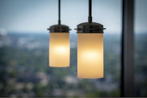 Two lights hanging from a ceiling.
