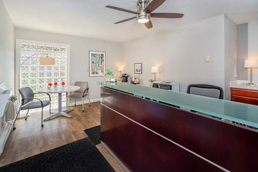 A reception area with a desk and chairs.