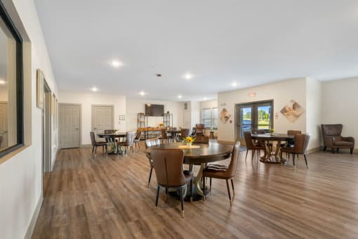 Spacious dining room with tables and chairs at 41 North Apartments, Fort Wayne
