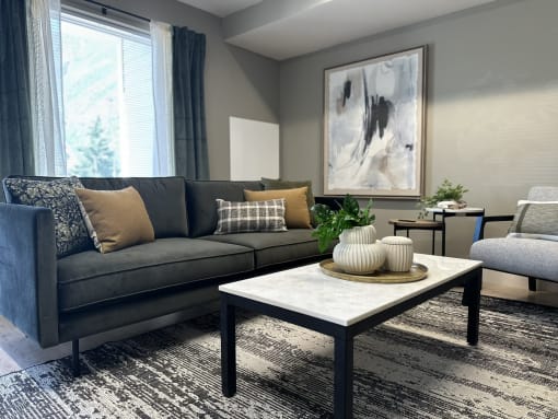 a living room with a gray couch and a coffee table  at MountainView Flats, Colorado, 81601