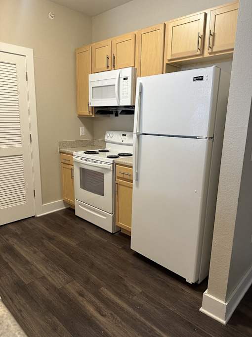 Kitchen with Wooden Cabinets at North Harrison Senior Apts in Shelbyville, IN