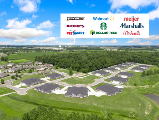 an aerial view of a residential neighborhood with a blue sky in the background at Morada at Maysville, Fort Wayne, IN 46815
