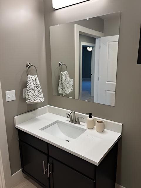 a bathroom with a white sink and a mirror at MountainView Flats, Glenwood Springs, CO