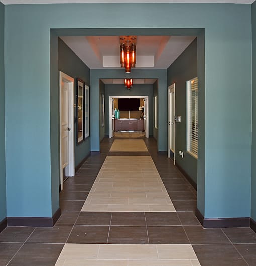 A long hallway with a light at the end.