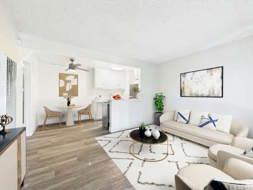 A living room with a white couch and a coffee table.