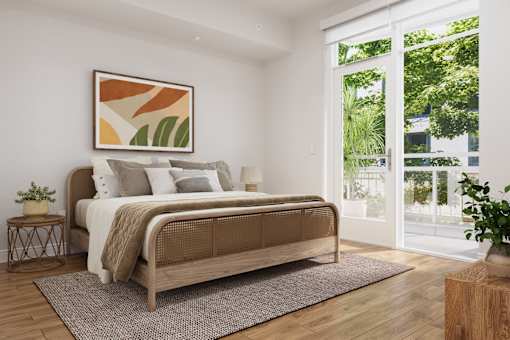 A bedroom with a large bed and a painting on the wall.