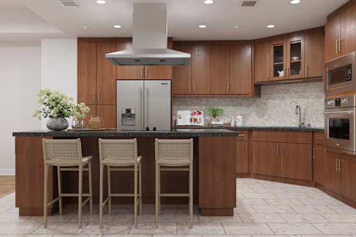 A kitchen with a black granite countertop and wooden cabinets.
