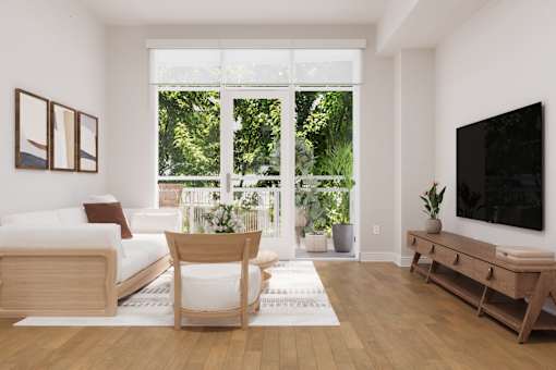 A living room with a white couch, a wooden chair, a wooden table, and a flat screen TV.