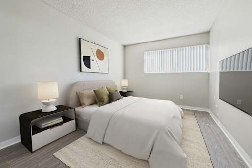 A bedroom with a bed, nightstand, and lamp.