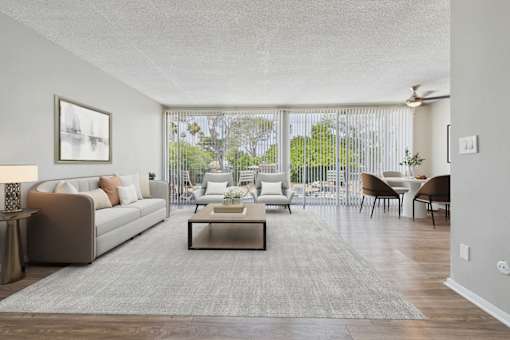 A living room with a couch, chairs, and a coffee table.