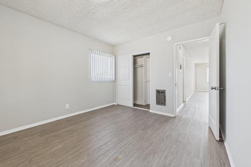 A room with a door and a window.