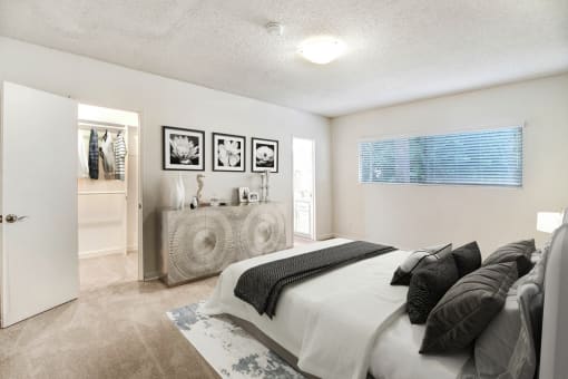 a bedroom with a bed and a dresser