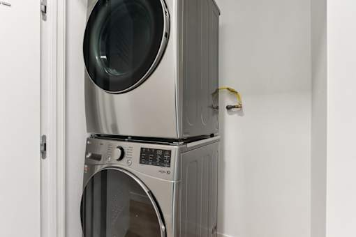 A stack of a washing machine and dryer.