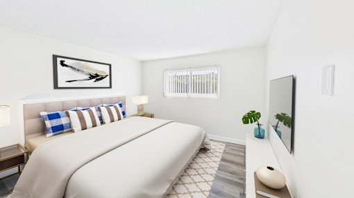 A bedroom with a large bed and a painting on the wall.