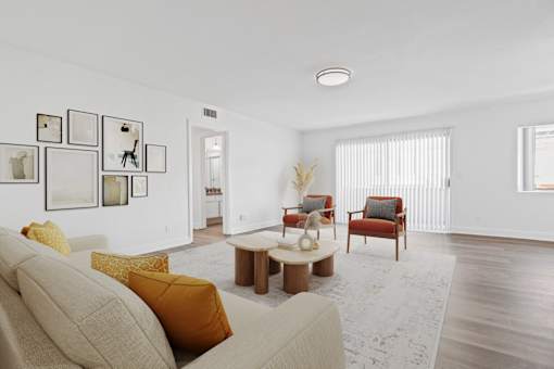 A living room with a beige couch and a coffee table.