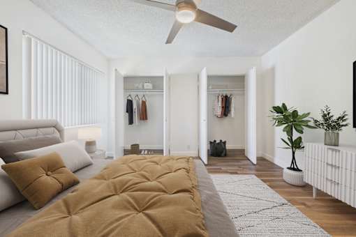 A living room with a brown sofa and a grey couch.