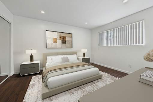 A bedroom with a large bed and a painting on the wall.